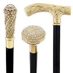 Gold walking canes with polished gold-colored handles in classic and decorative styles, shown together to compare their shapes and finishes